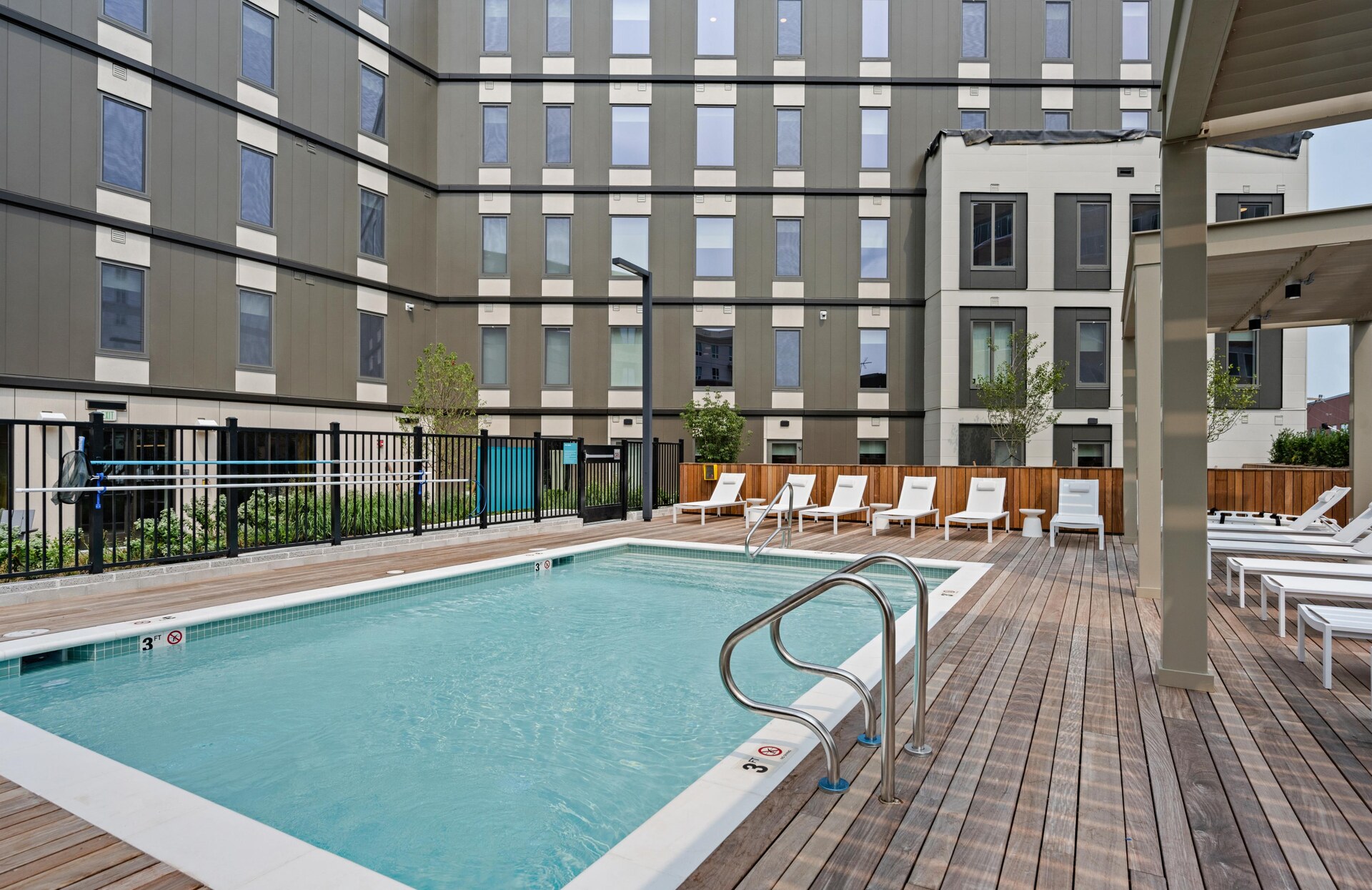 Deck loungers by the sparkling community pool.