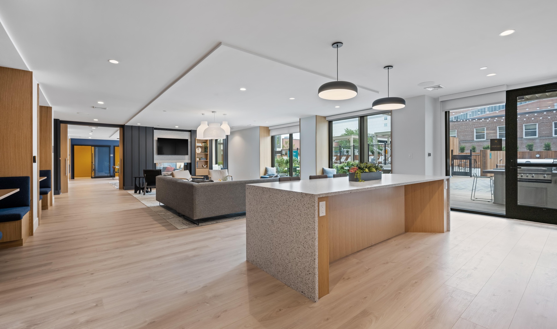 Lounge area with sectional and community kitchen for socializing